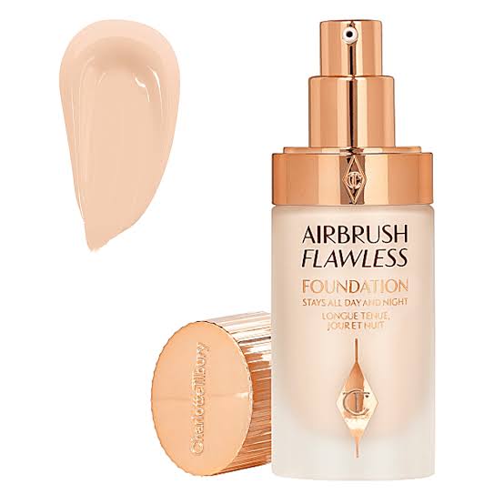Airbrush Flawless foundation bottle with applicator and swatch on a white background