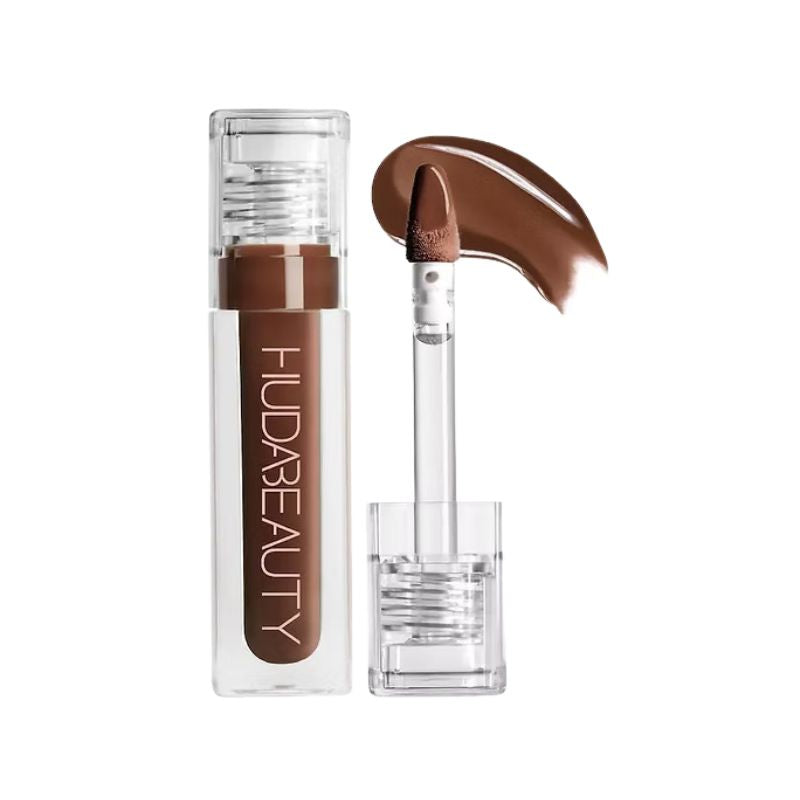 Huda Beauty lip product with applicator on a white background