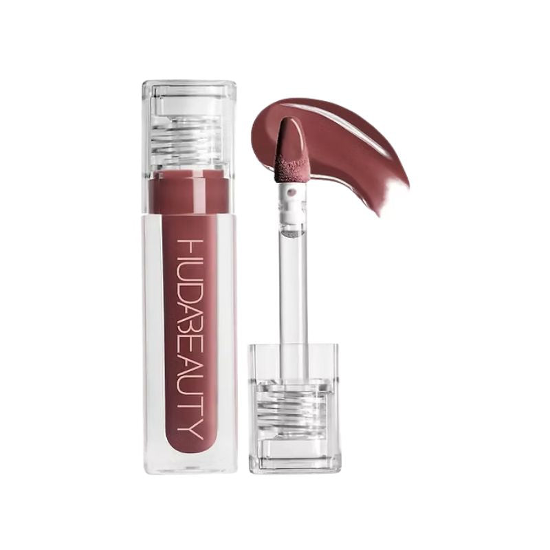 Lipstick with clear casing and visible brand name on a white background