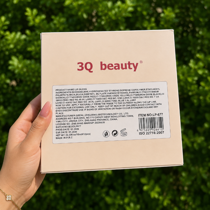 3Q beauty product packaging held by a hand with a green leafy background