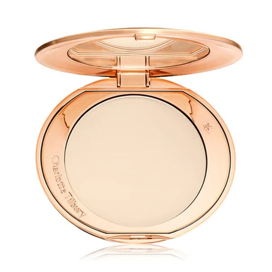 Rose gold compact powder with visible brand name on a white background