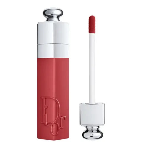 Lip gloss with red shade and silver accents on a white background