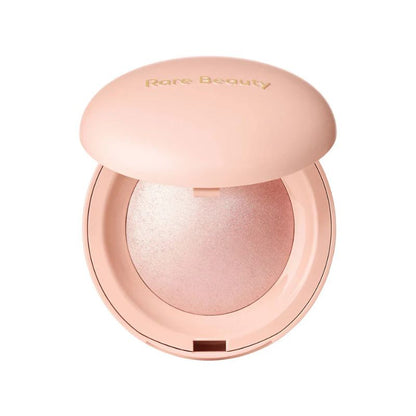 Compact powder with 'Rare Beauty' branding on a white background