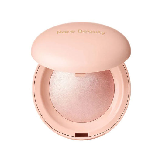 Compact powder with 'Rare Beauty' branding on a white background