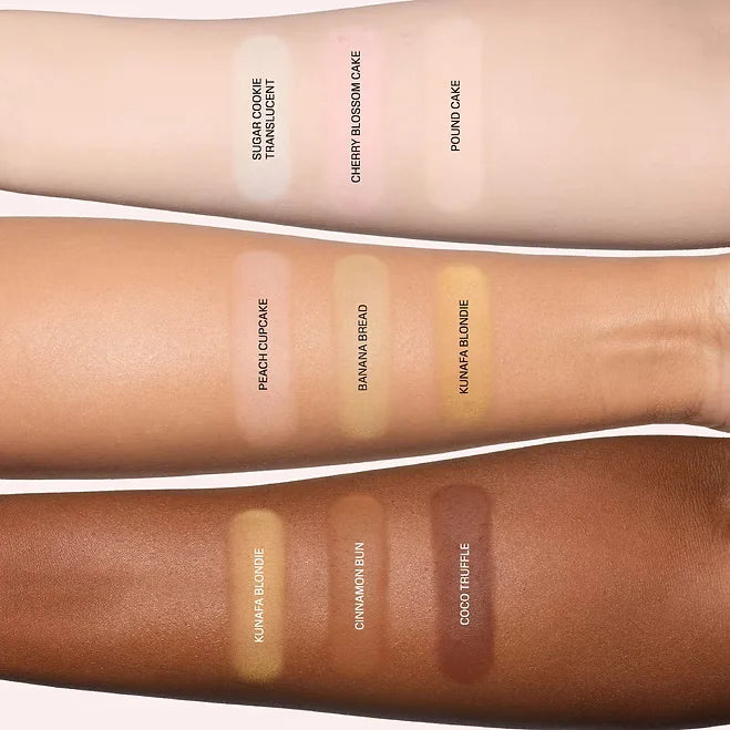 Three forearm swatches display makeup color swatches labeled 'Double Cone Translucent', 'Cherry Blossom Cake', 'Pound Cake', 'Peachy Cupcake', 'Banana Bread', 'Kumara Blonde', 'Kumara Blonde', 'Cinnamon Skin', and 'Cocoa Truffle'.