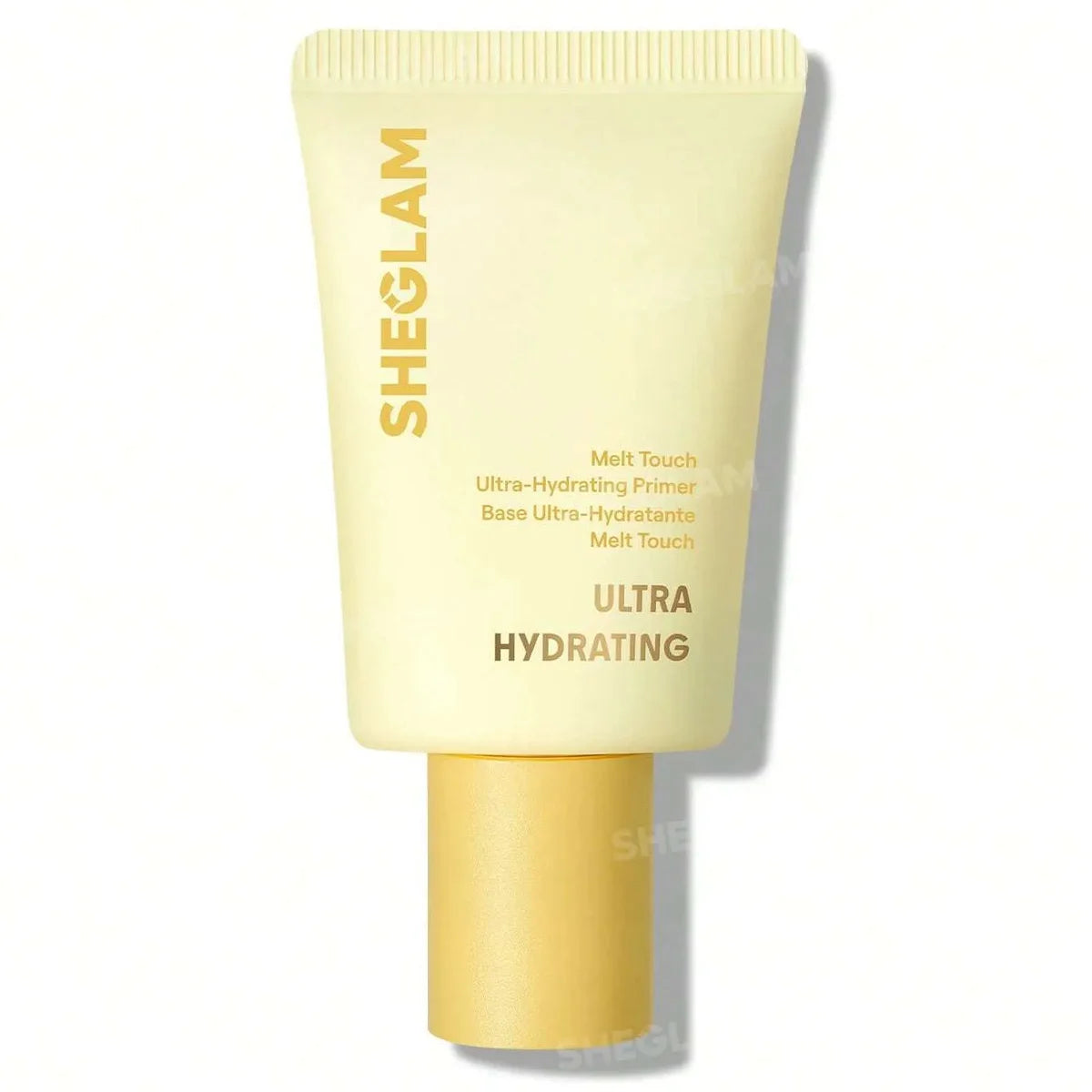 A squeeze tube of SHEGLAM Ultra Hydrating Melt Touch Primer in a pale yellow shade, featuring gold text and a matching gold cap, set against a plain white background.