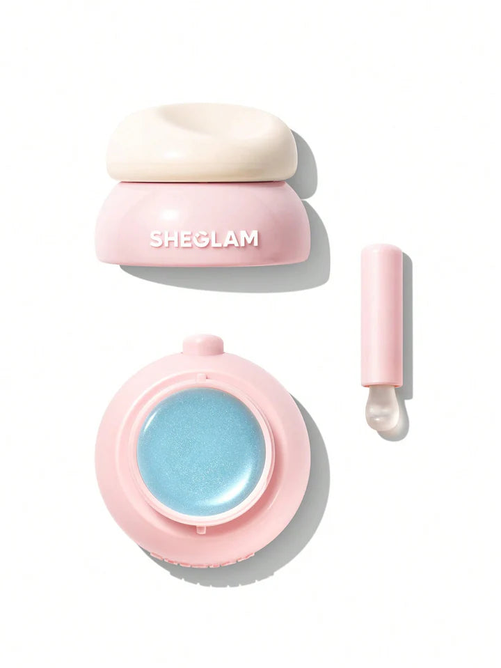 Pink cosmetic container with blue gel and applicator on a white background, featuring the brand 'SHEGLAM'.